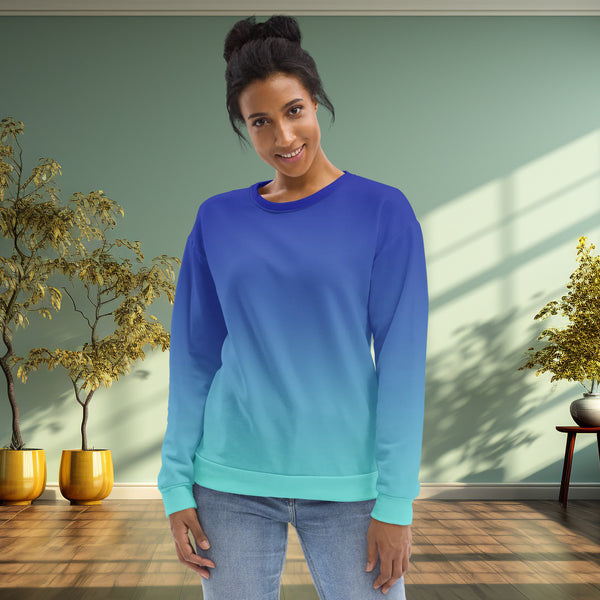 woman wears a transitioning gradual blue sweatshirt, front side