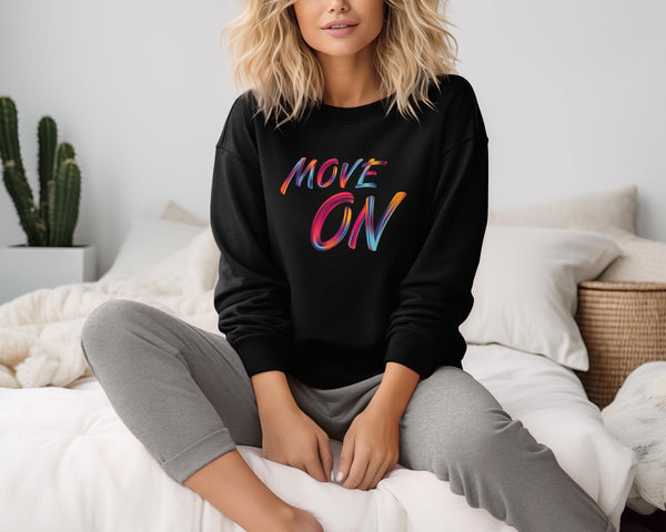 woman wearing a black motivating sweatshirt with  colorful print "move on"