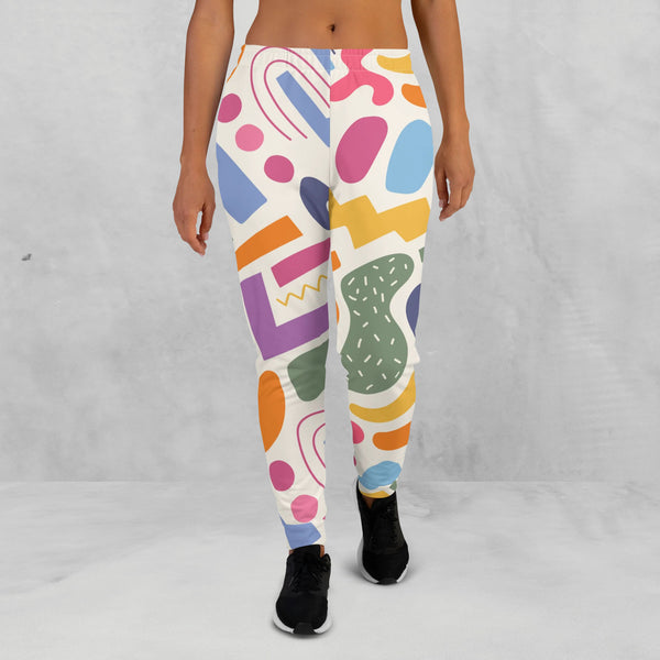 woman wearing a colorful joggers with shapes, front side