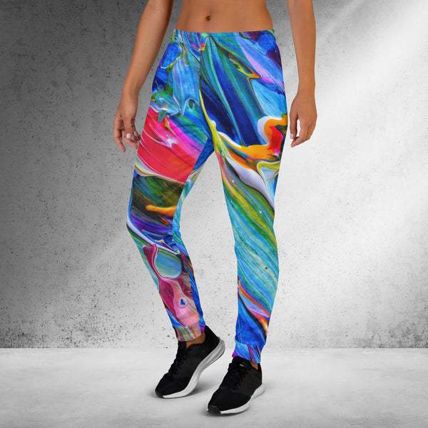 woman wearing a colorful paint-brushed joggers, left side